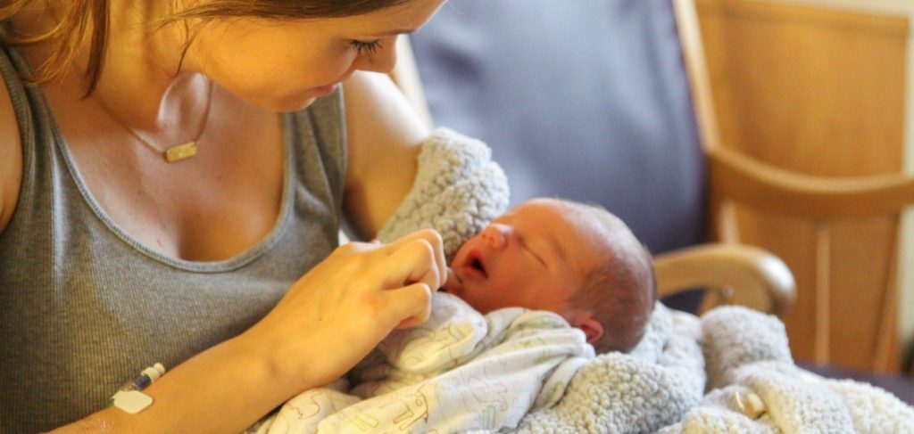 Woman Holds Newborn at Asheville Women's Medical Center